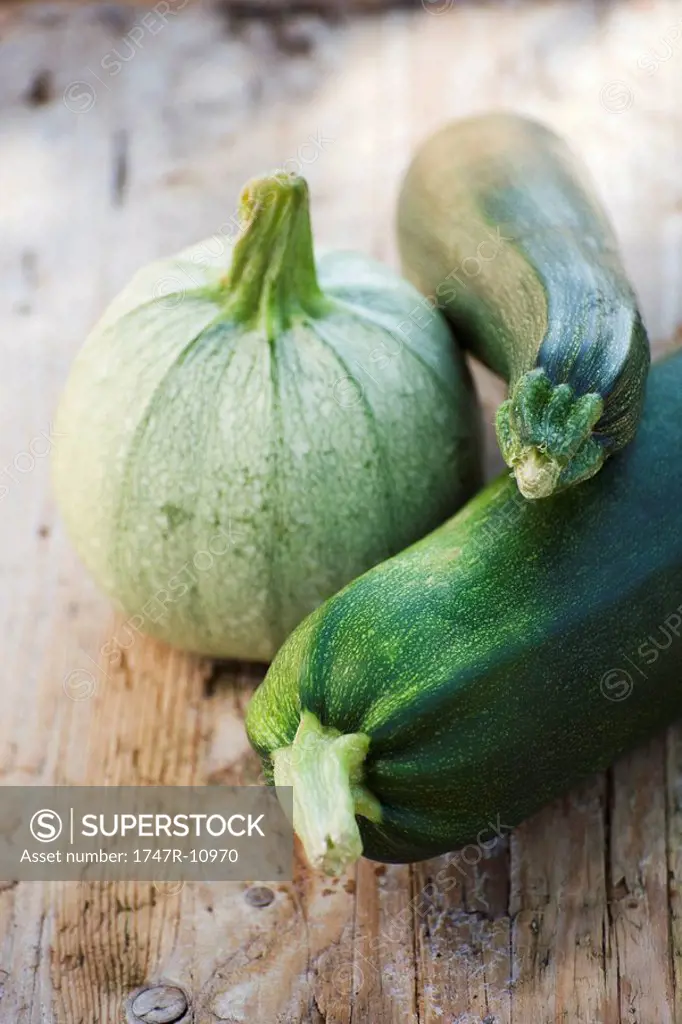 Zucchini and squash on wooden background