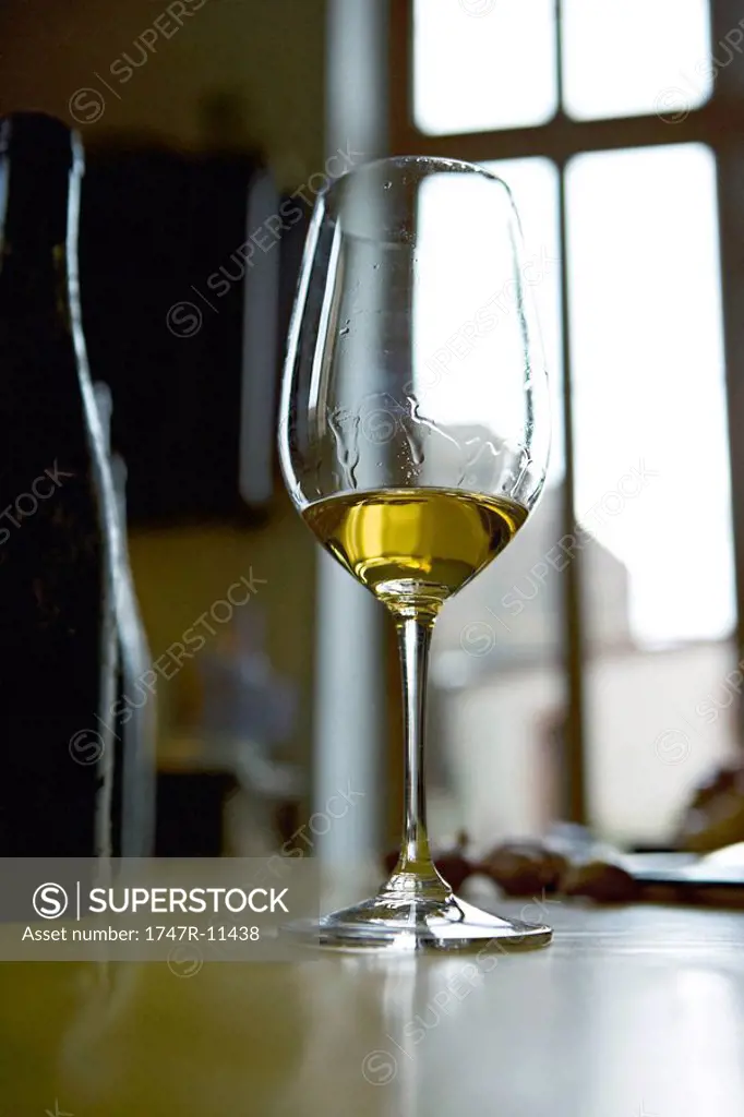 Streaked glass of white wine