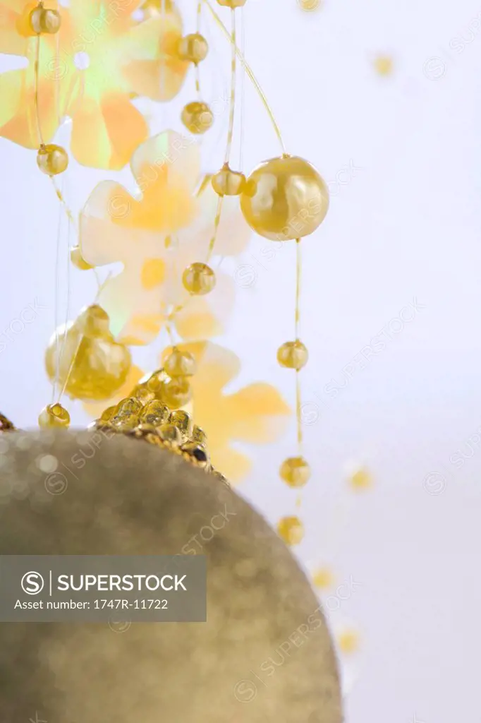 Gold ornament and decorative garland, close-up