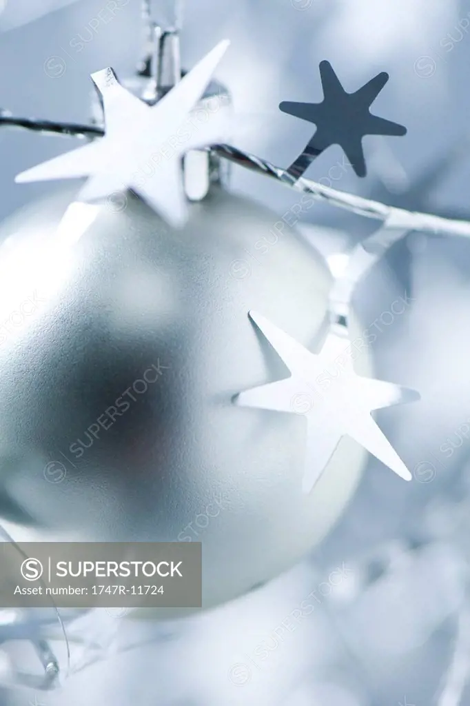 Silver Christmas ornament and star garland, close-up