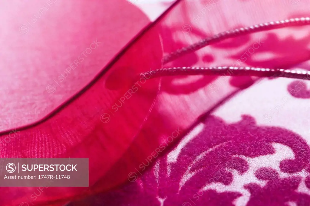 Magenta fabric and ribbon, extreme close-up