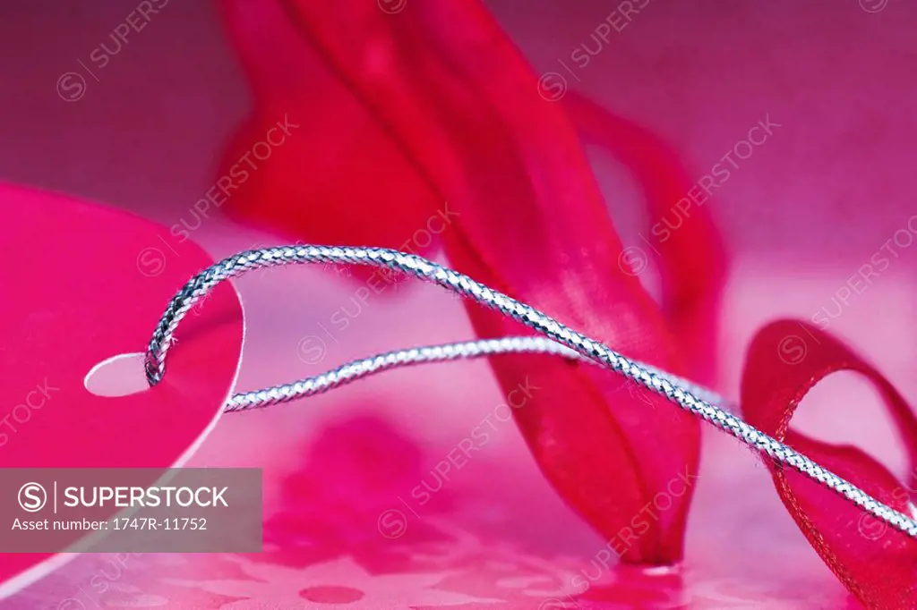 Pink gift tag and ribbon, extreme close-up