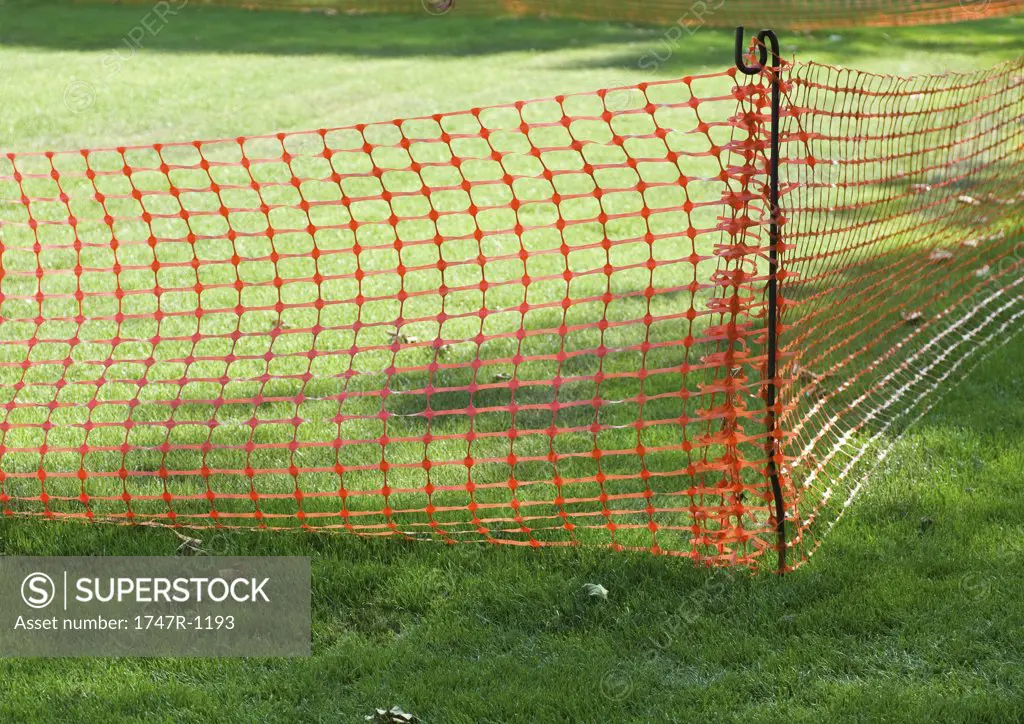 Plastic mesh fence on grass