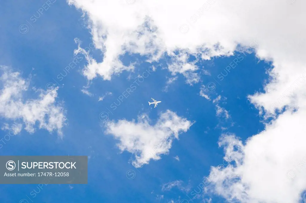 Commercial airplane flying through cloudscape