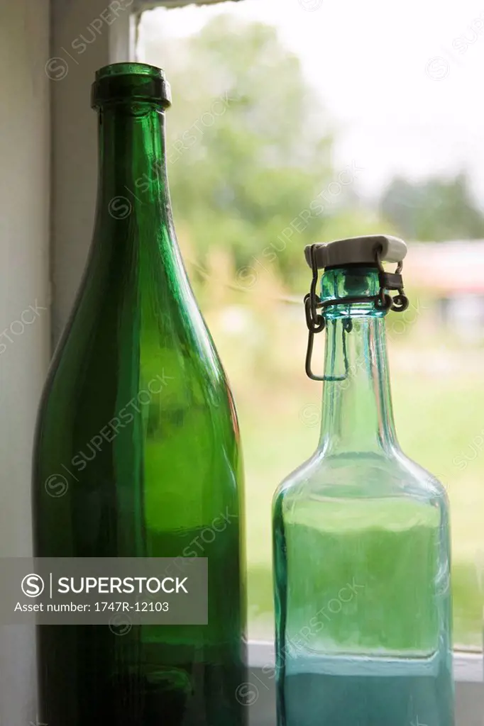Bottles set in windowsill