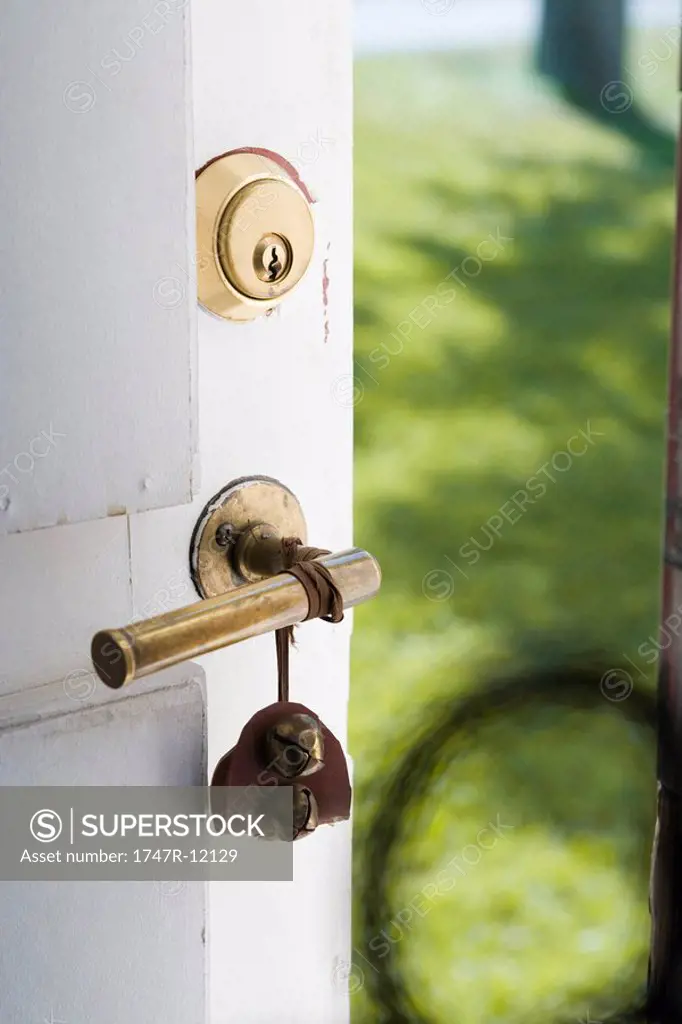 Bell on handle of open door