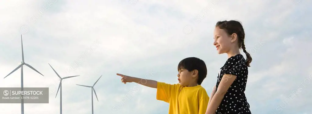 Children looking at wind turbines