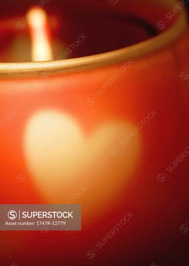 Candleholder with heart pattern, extreme close-up