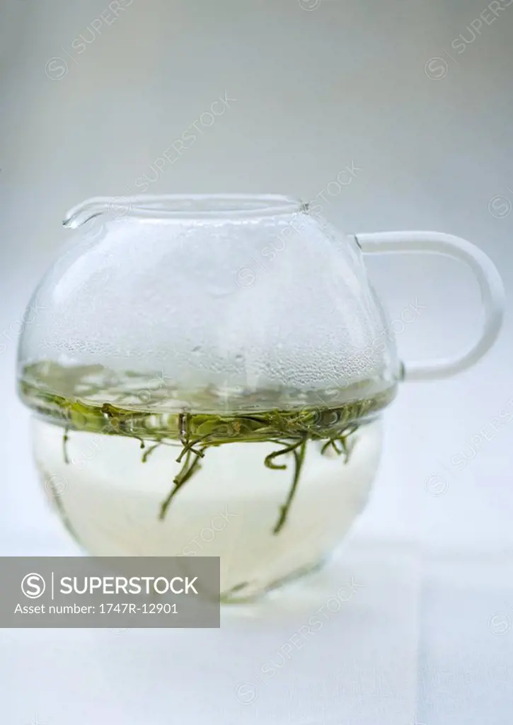 Green tea steeping in tea pot