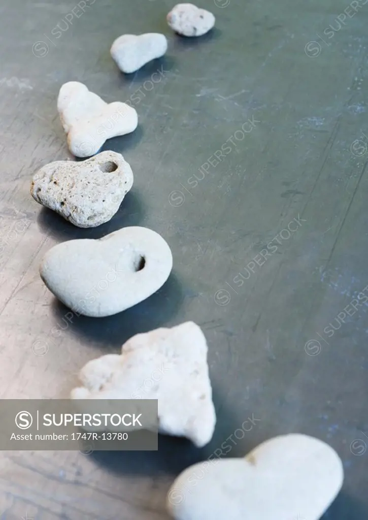 Heart-shaped stones arranged in curved line