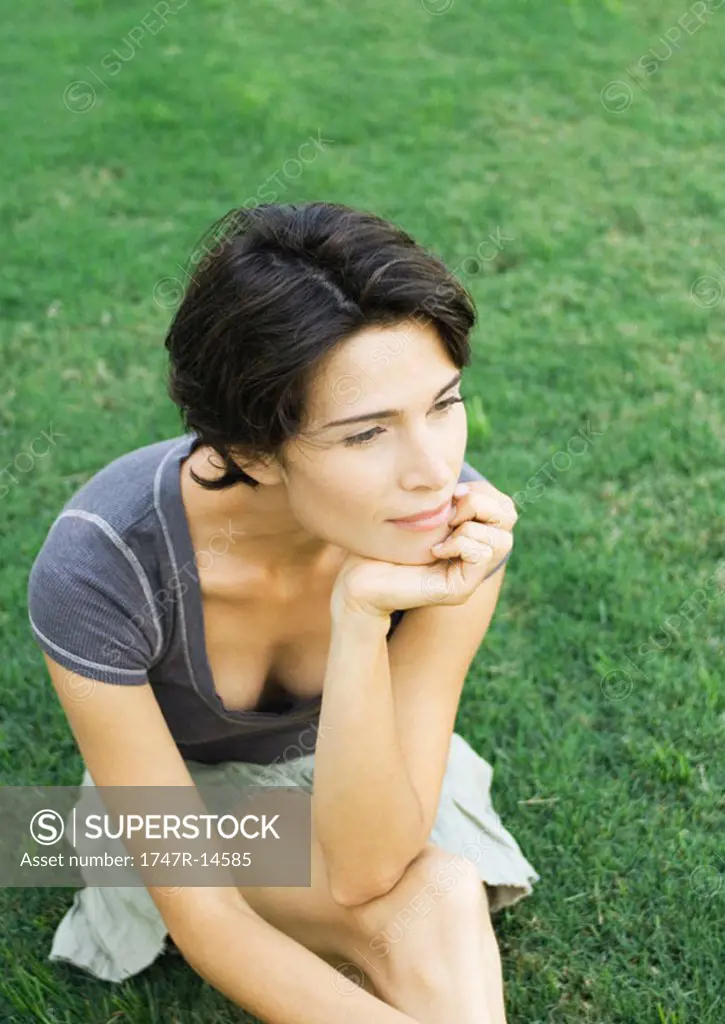 Woman sitting in grass
