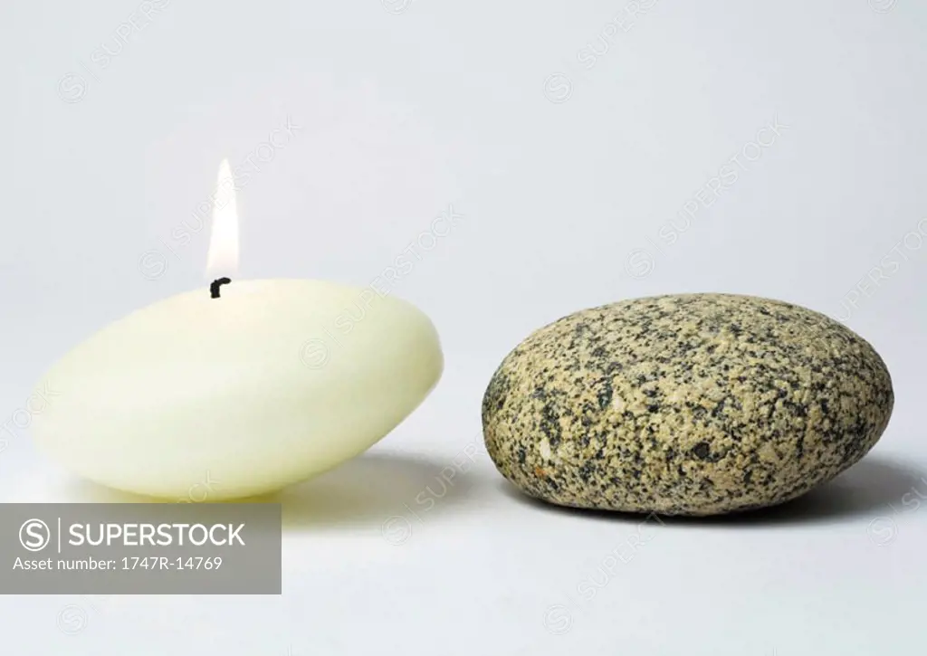 Candle and stone