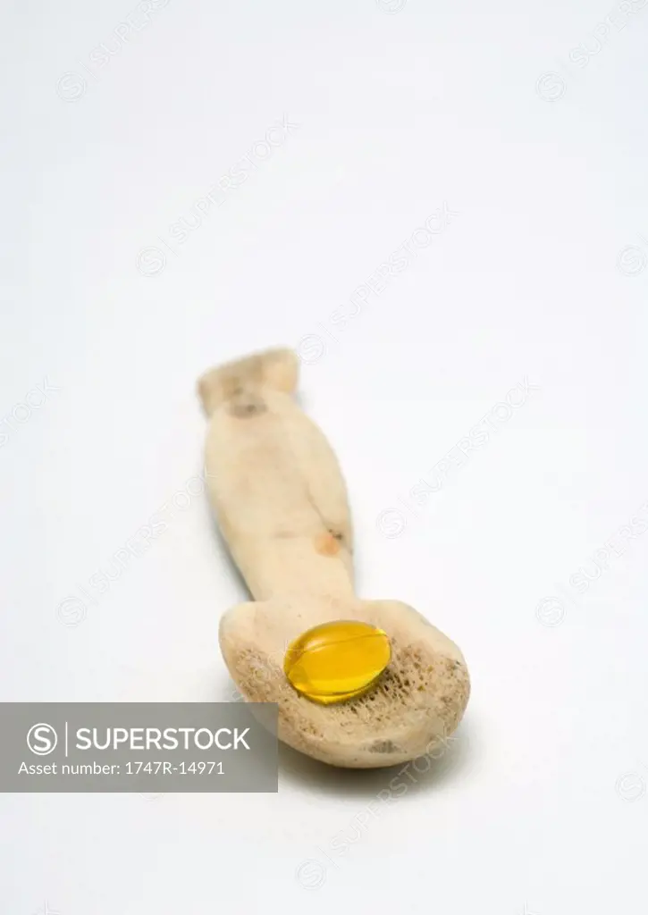 Gelcap in bone spoon