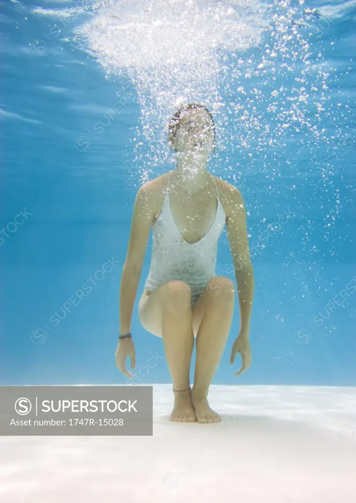 Teenage girl in pool, underwater view