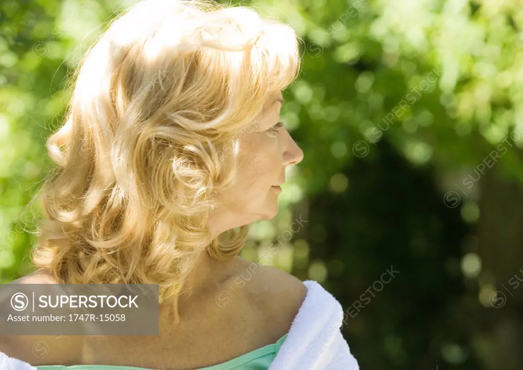 Senior woman looking over shoulder, portrait