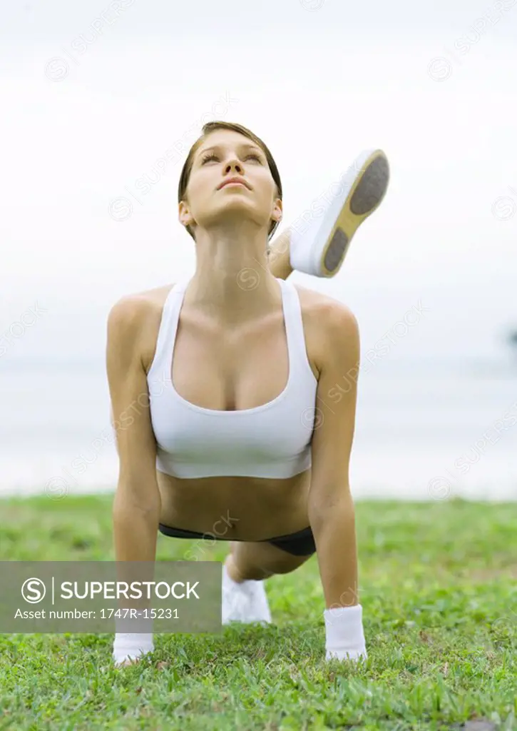 Young woman working out, outdoors