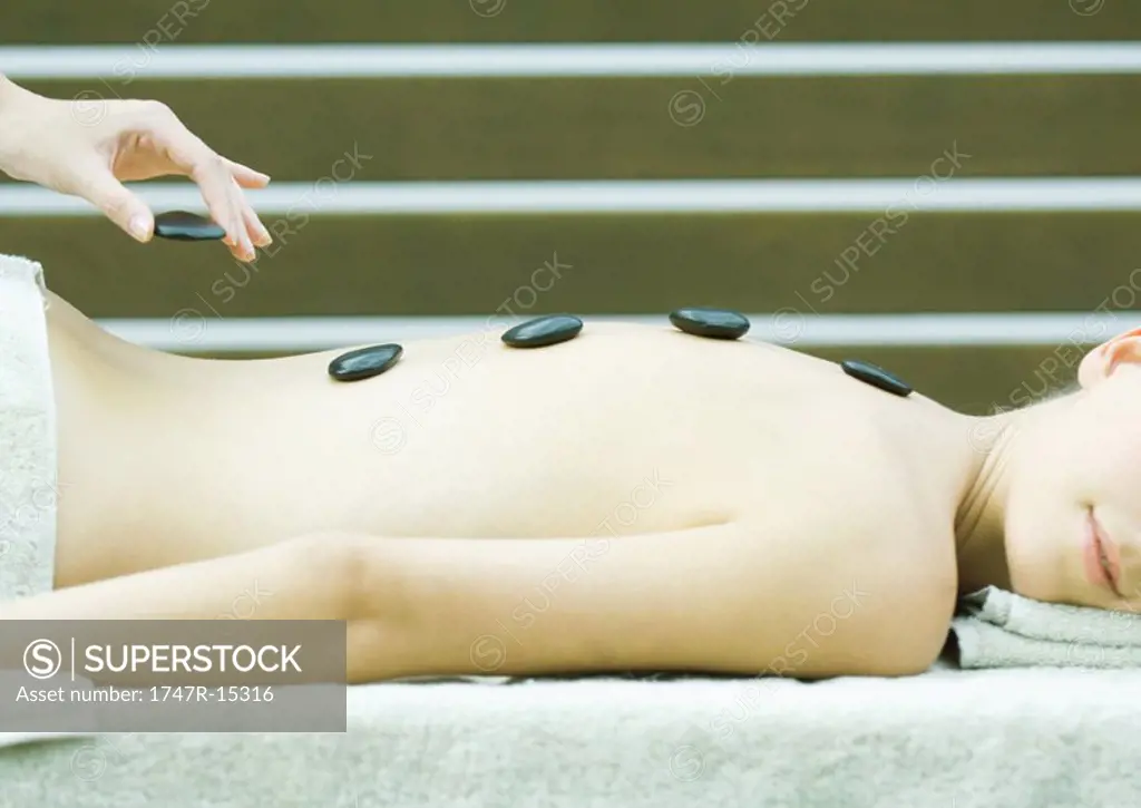 Woman having lastone therapy massage