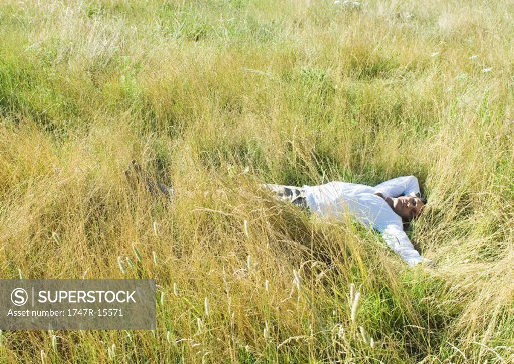 Man lying in field