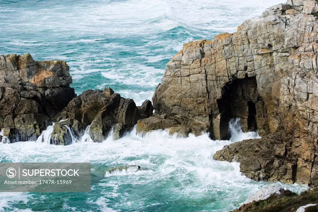 Waves crashing on coastal cliffs, Brittany, France