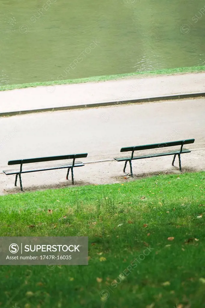 France, Paris, benches facing water in park