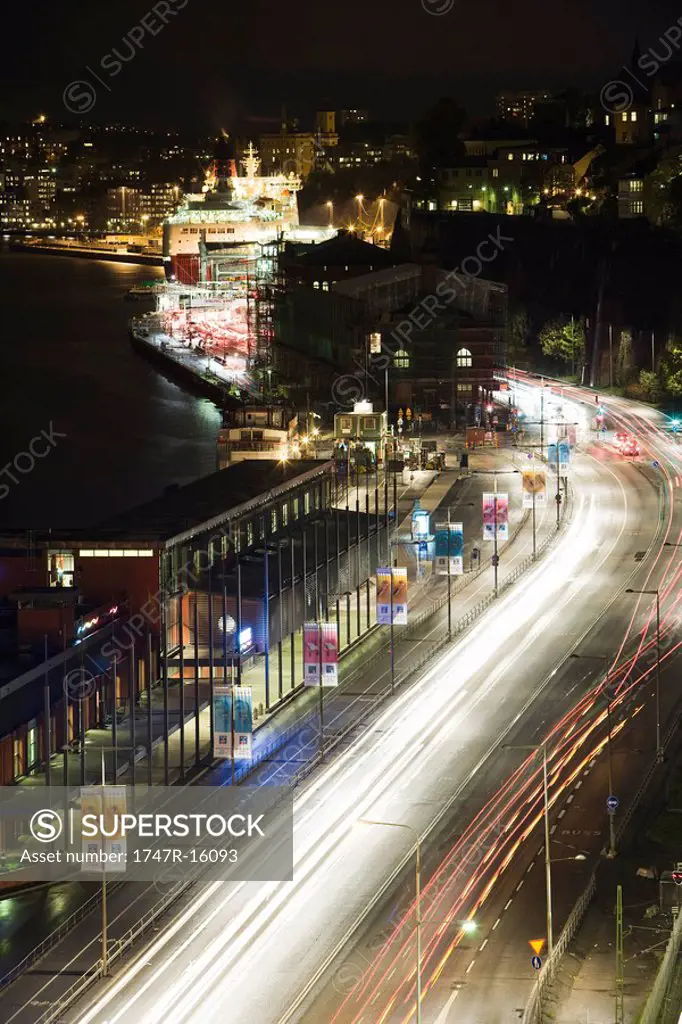Sweden, Sodermanland, Stockholm, street illuminated by light trails at night