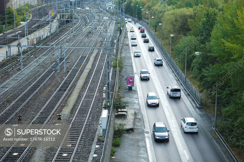 Sweden, Sodermanland, Stockholm, train tracks and street side by side