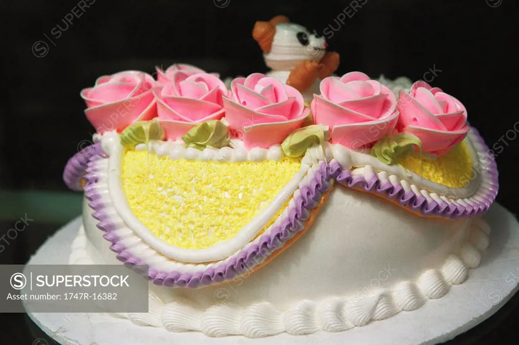 Birthday cake decorated with pink roses