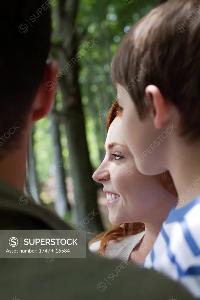Family in nature, focus on young woman