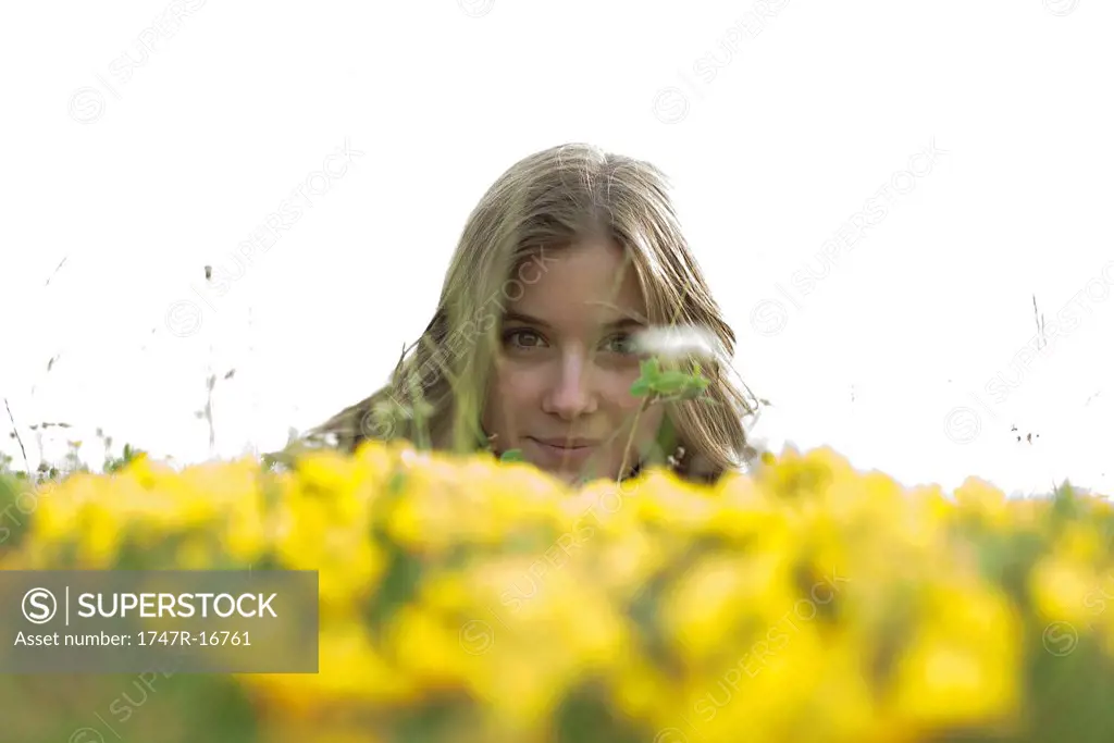 Young woman in flower field