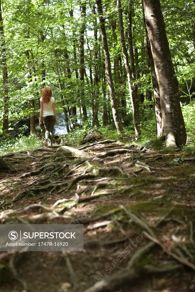 Woman walking in woods