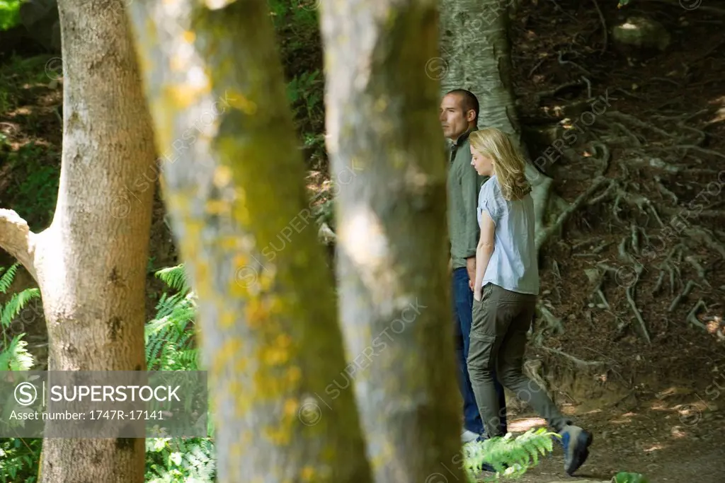 Couple walking in woods