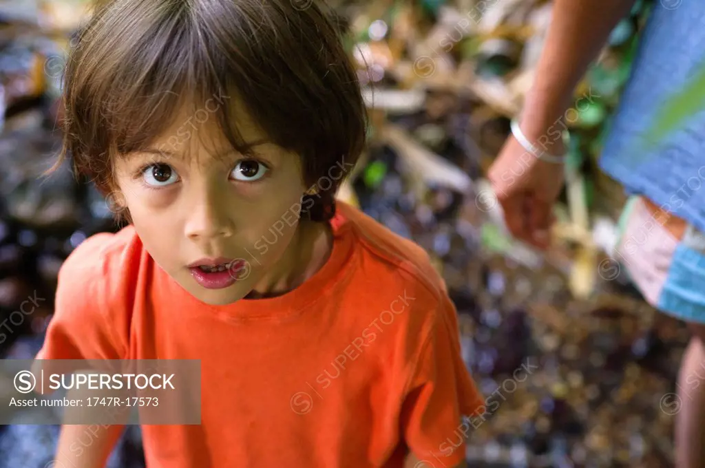 Boy looking at camera with awed expression