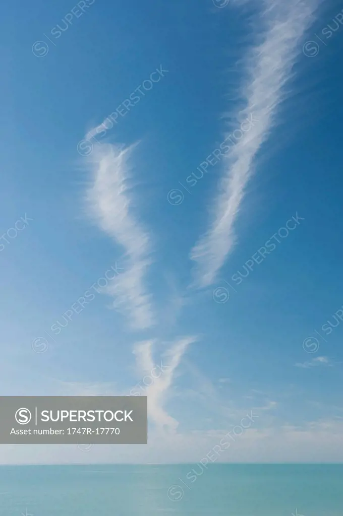 Cirrus clouds in sky over sea