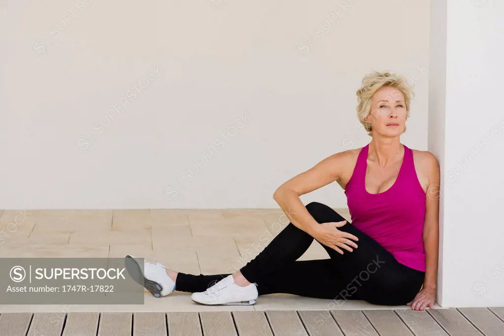Mature woman doing spinal twist