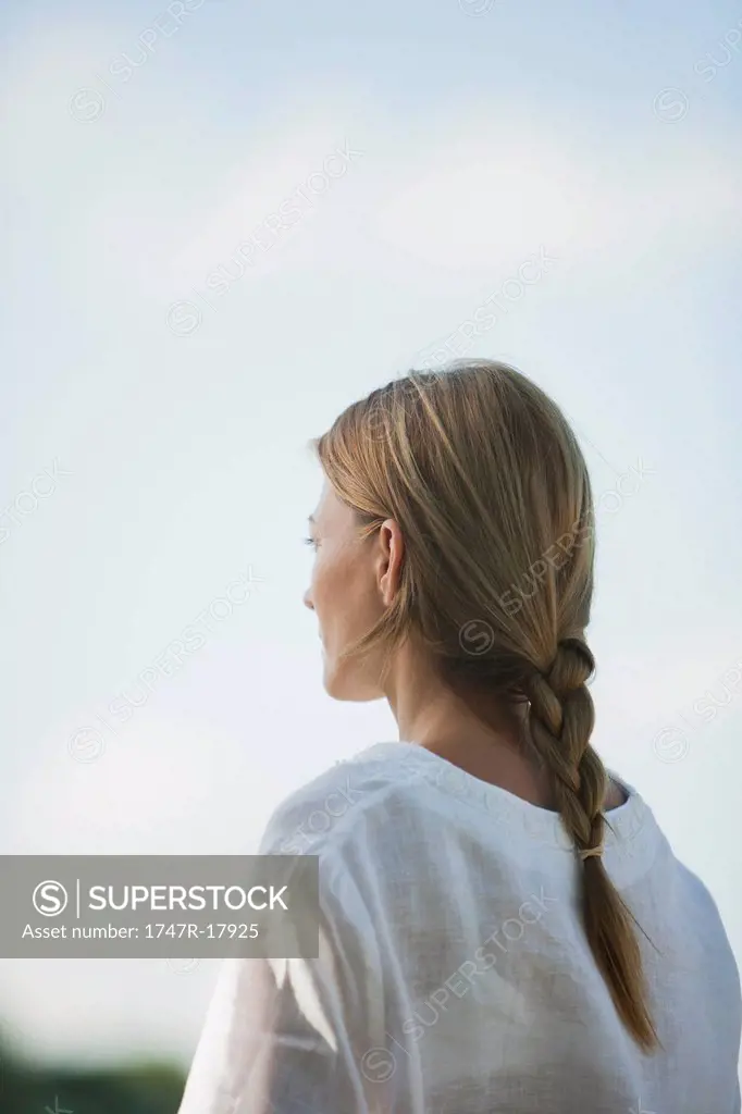 Mid_adult woman looking into distance