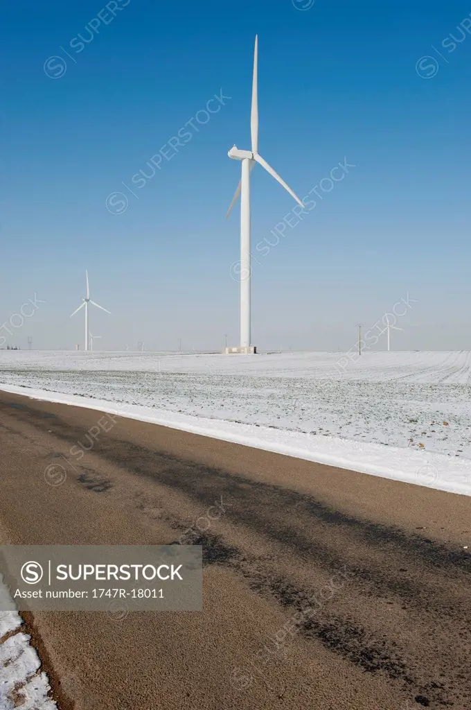 Wind turbines in field