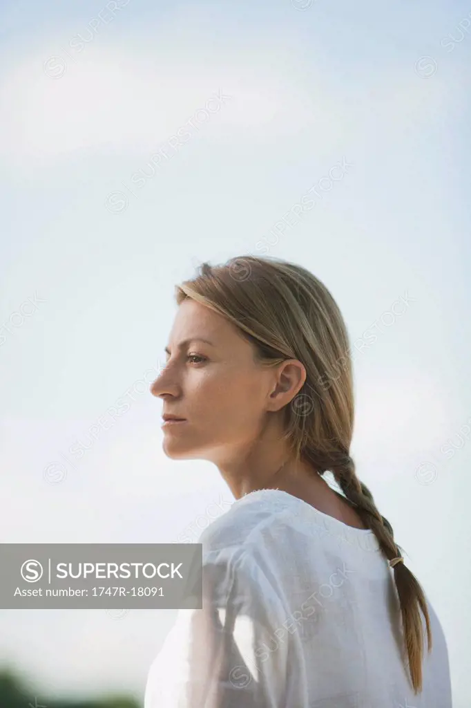 Mid_adult woman looking into distance