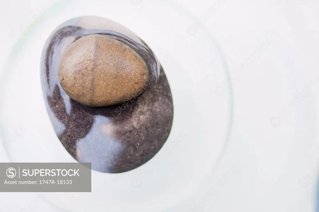 Two stacked stones partially submerged in water