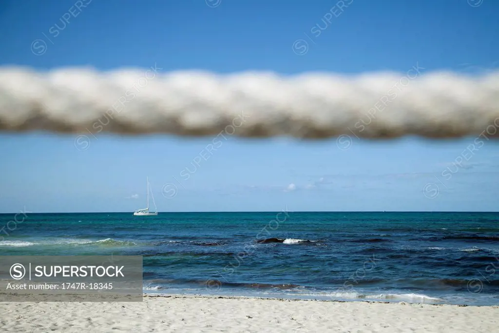Beach scene, rope in foreground