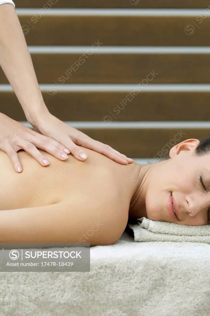 Young woman having back massage