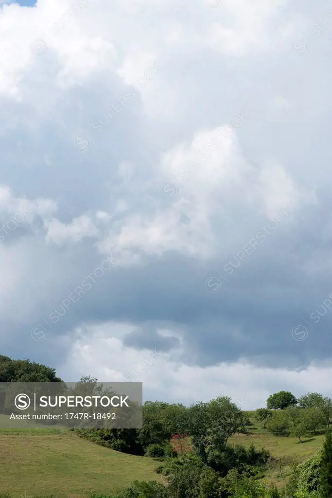Storm clouds over countryside