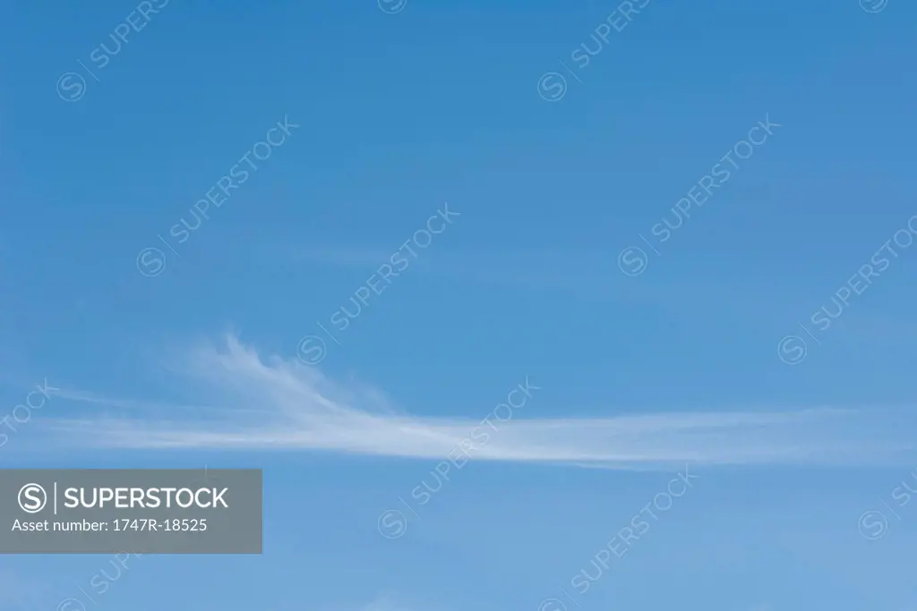 Wispy clouds in blue sky