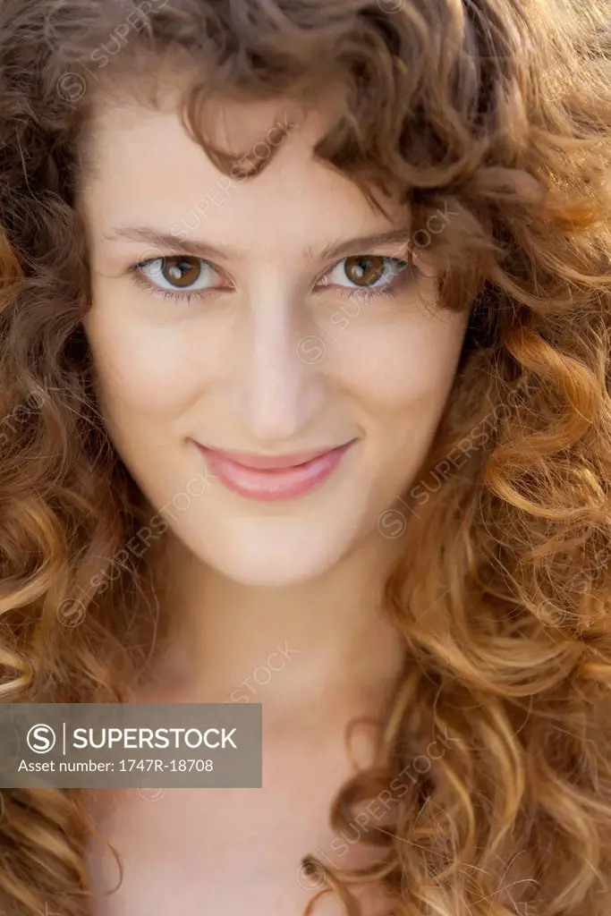 Young woman with curly hair, portrait