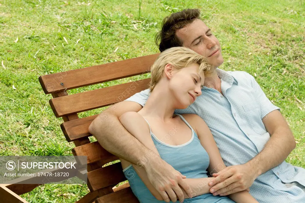 Couple relaxing together on lounge chair