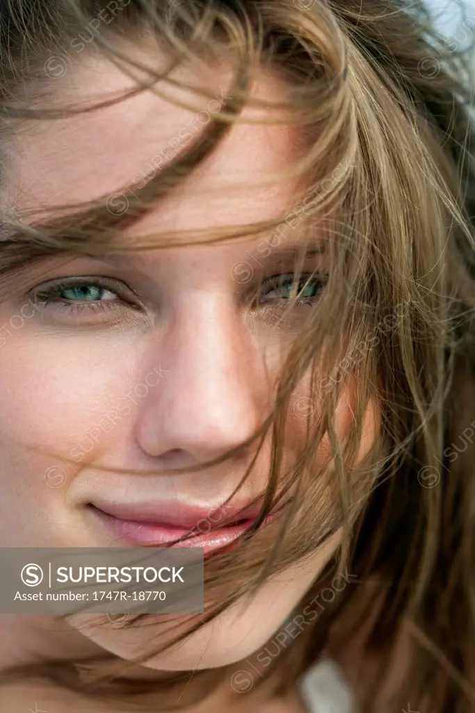Young woman with tousled hair, portrait