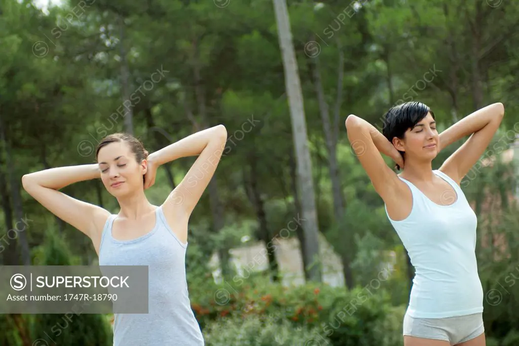 Young women exercising outdoors
