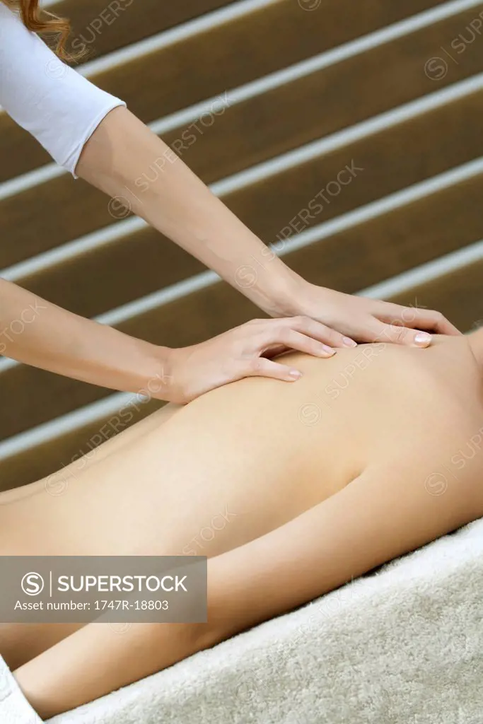 Young woman having back massage