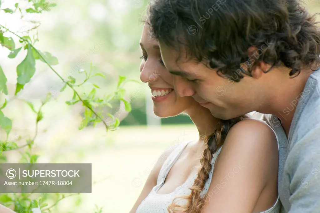 Young couple embracing outdoors