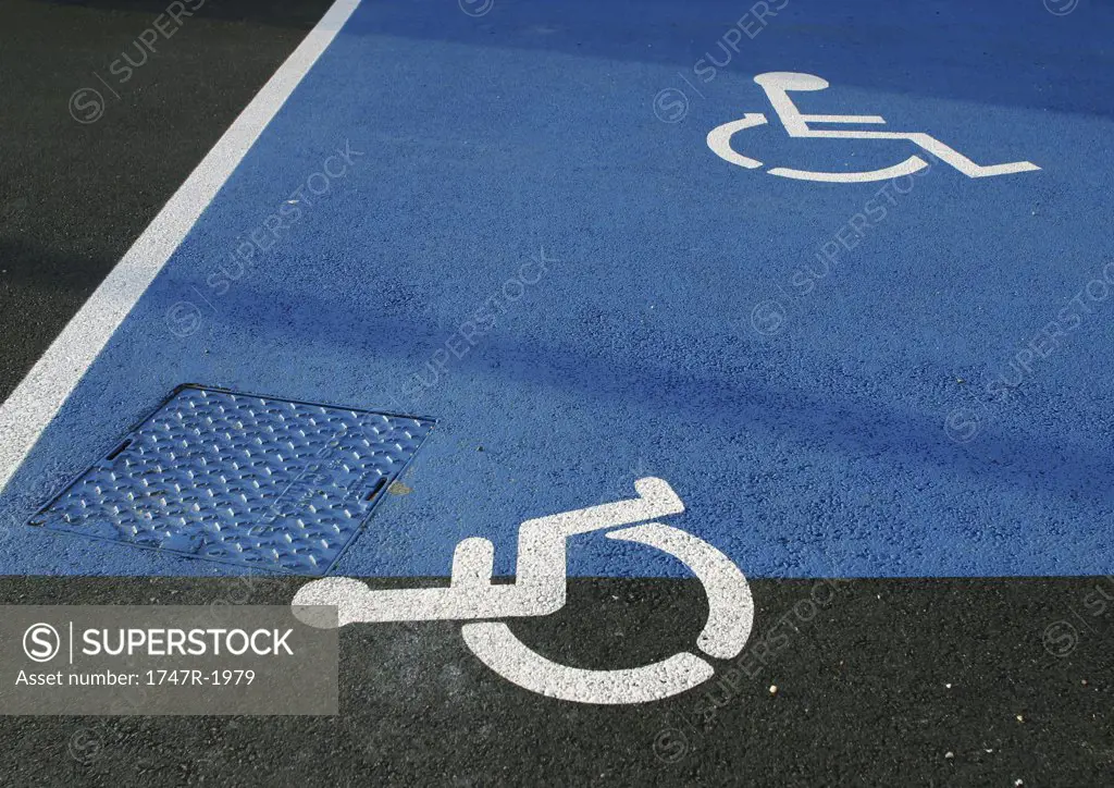 Handicapped symbols on asphalt