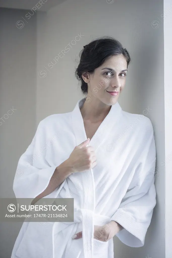 Woman relaxing in bathrobe, portrait